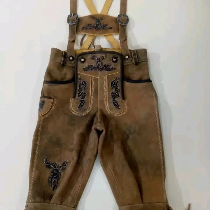 Walnut suede children's Kniebund lederhosen, dark stag Reliefstickerei, cream X-back suspenders, antique silver buckles — Haider Living Kleine Tracht collection