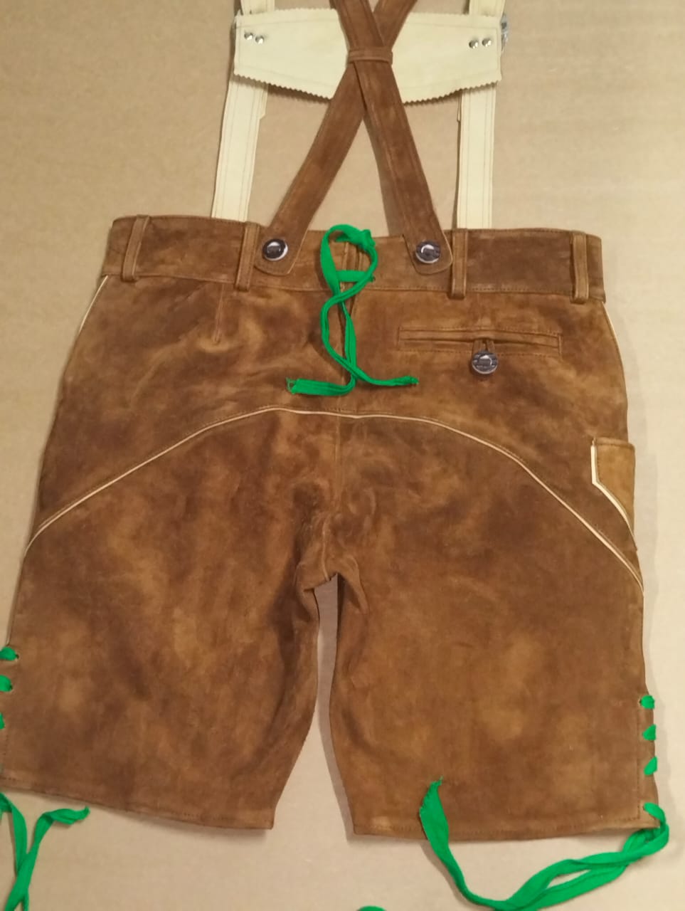 Walnut lederhosen rear view, zip pocket, cream piping, green lacing — Haider Living